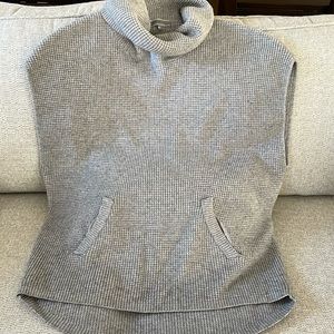 Mia & Tess sleeveless pullover sweater with cowl neck and kangaroo pockets.